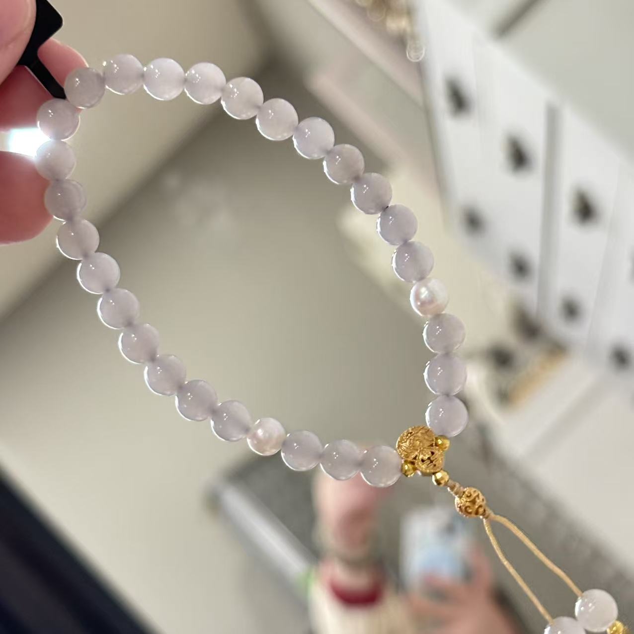 features 6mm beads jade, accented with natural pearls and silver components