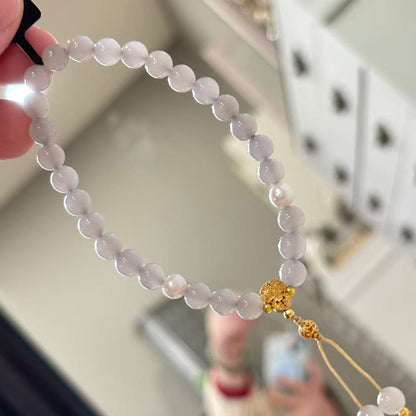 features 6mm beads jade, accented with natural pearls and silver components
