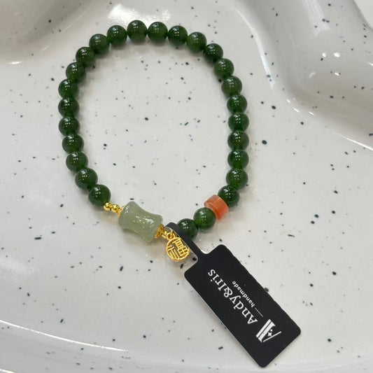 feature&nbsp;6mm jade beads, accented with Nanhong agate, silver, and amber
