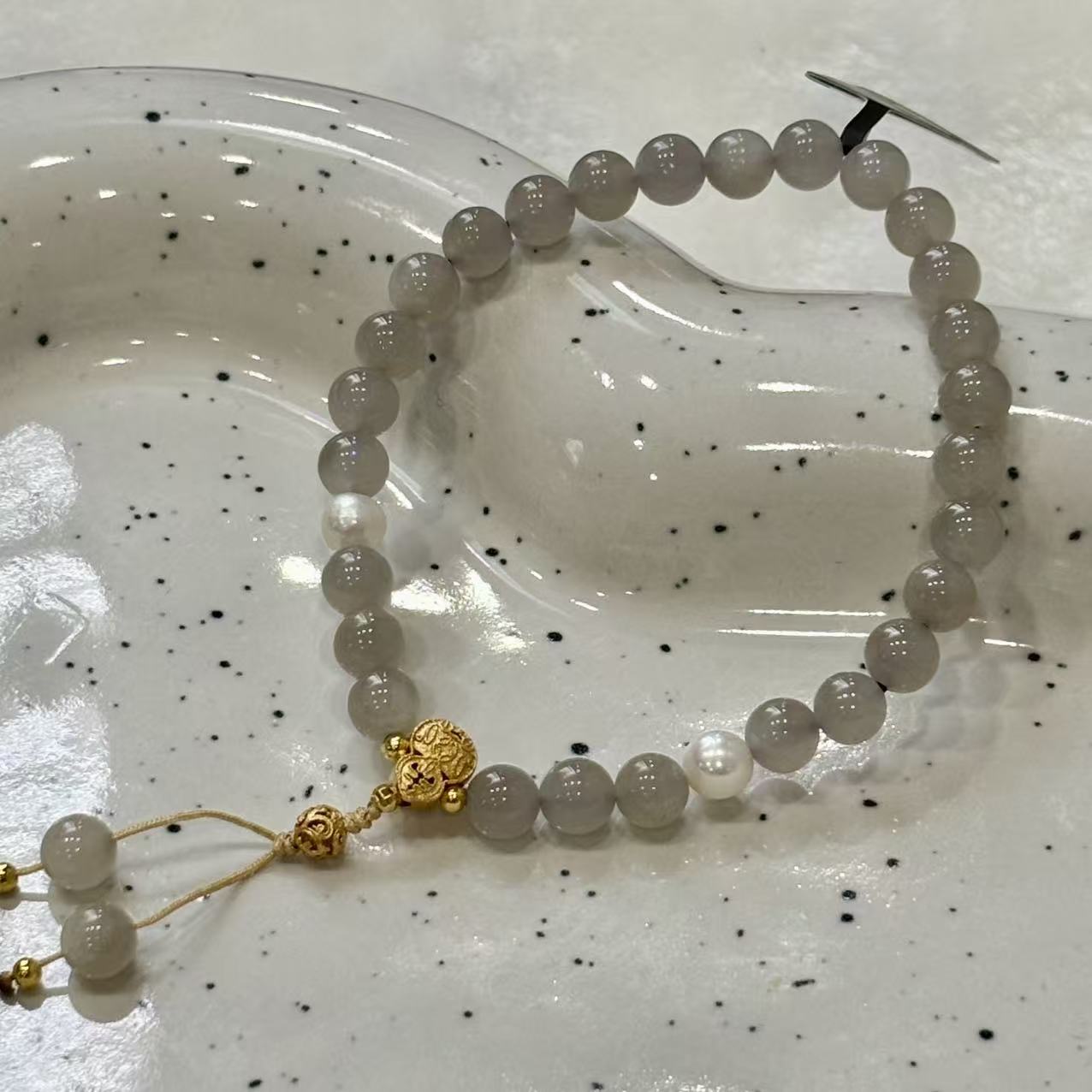 features 6mm beads jade, accented with natural pearls and silver components