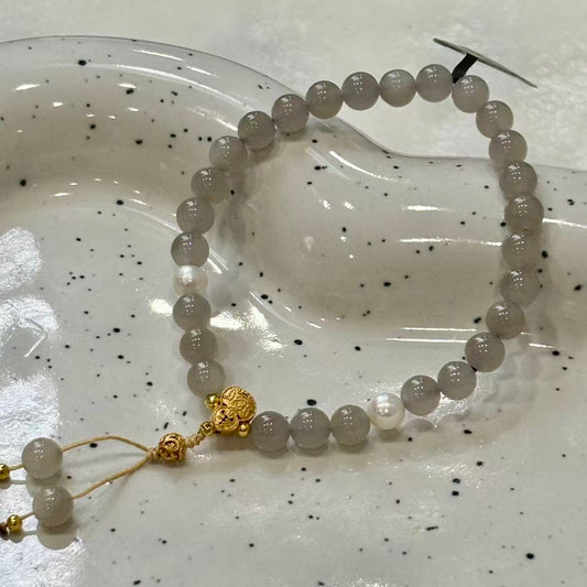 features 6mm beads jade, accented with natural pearls and silver components